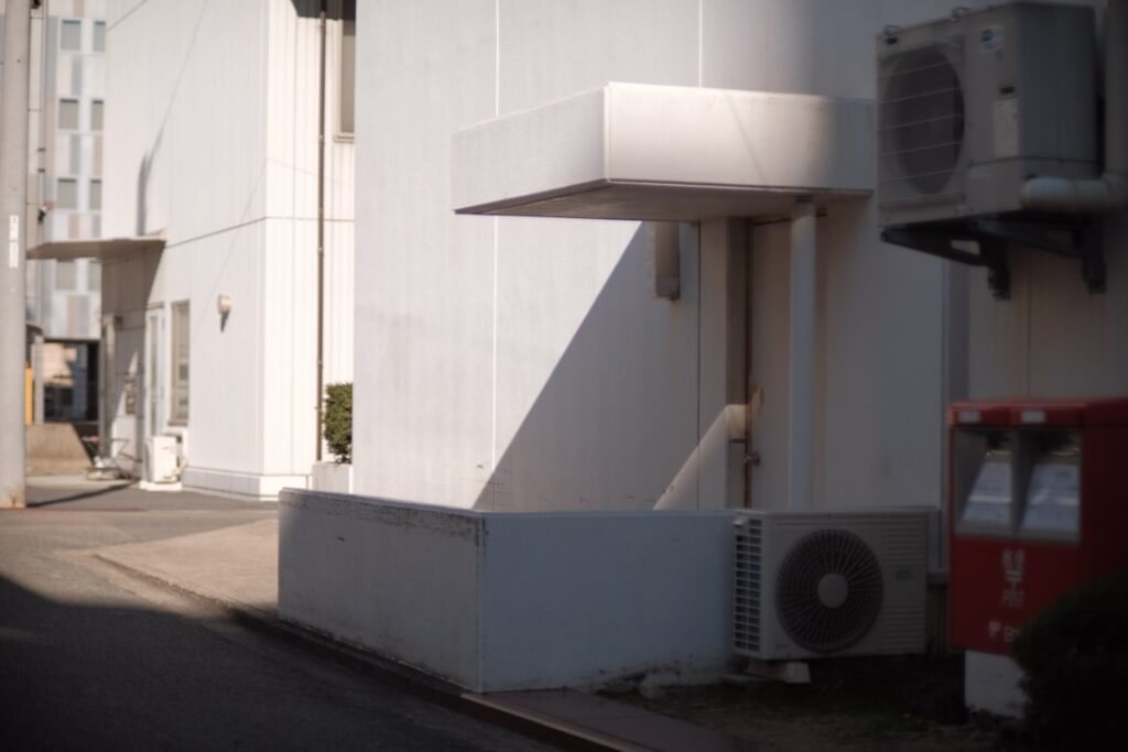 Commercial building exterior featuring an air conditioning unit, highlighting essential HVAC solutions for businesses in Weatherford, TX.